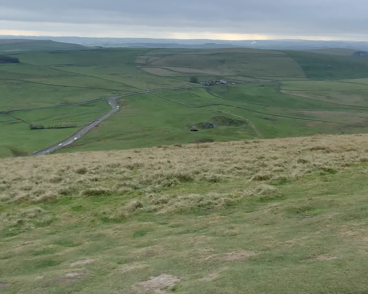 The from the top of Mam Tor showing hills and roads in the distance